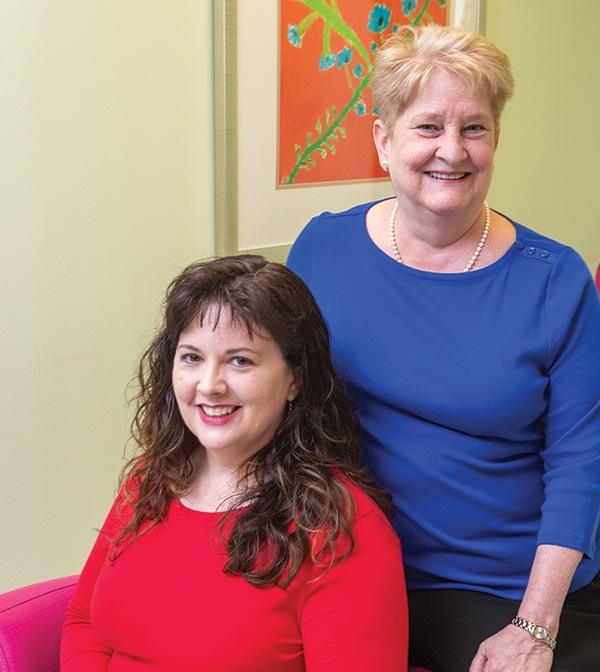 Dr. Beverly Rogers (right) and Dr. Alexis Carter at Children’s Healthcare of Atlanta, where the laboratory formed an “enter/edit” team of three technologists who enter outside results into the EHR all day, with appropriate protocols and quality checks. “Combining different laboratories’ results into the EHR has the potential to present a patient safety risk every day,” Dr. Rogers says. Photo credit: Jenni Girtman